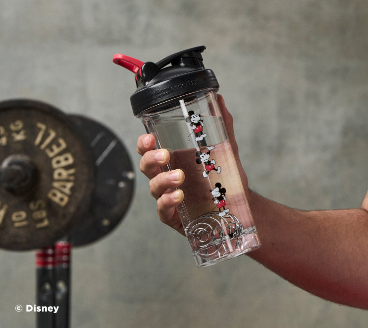 pro-series-n4 Mickey_Mouse_Protein_Shaker_Bottle_Being_Held_In_the_Gym.jpg